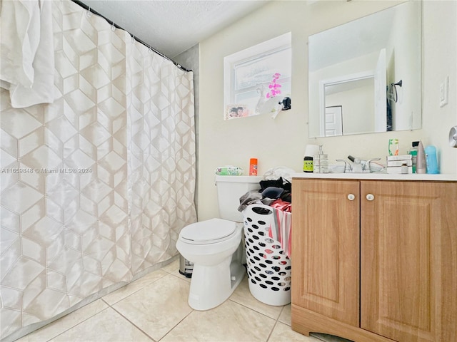 bathroom with vanity, a textured ceiling, tile patterned floors, a shower with curtain, and toilet