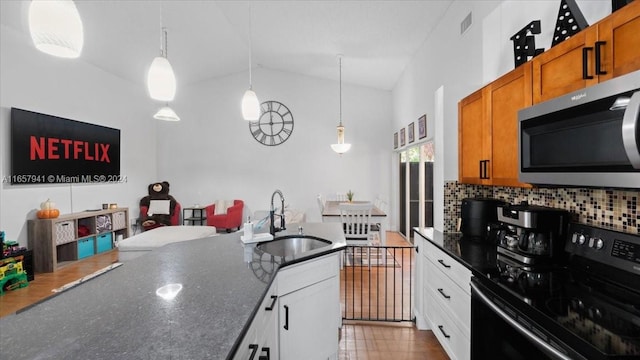 kitchen with pendant lighting, white cabinetry, black range with electric stovetop, and sink