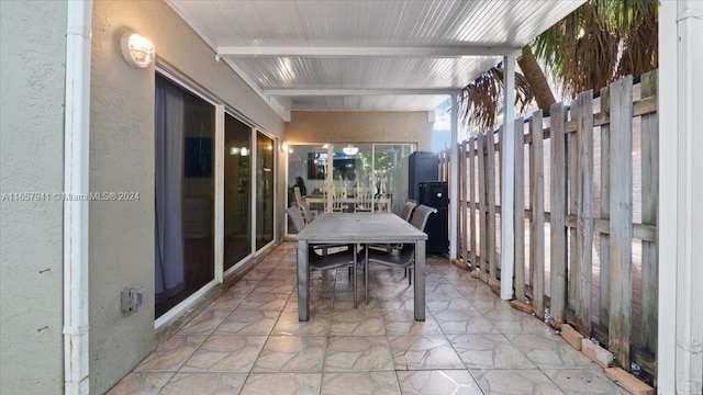 sunroom / solarium with beam ceiling