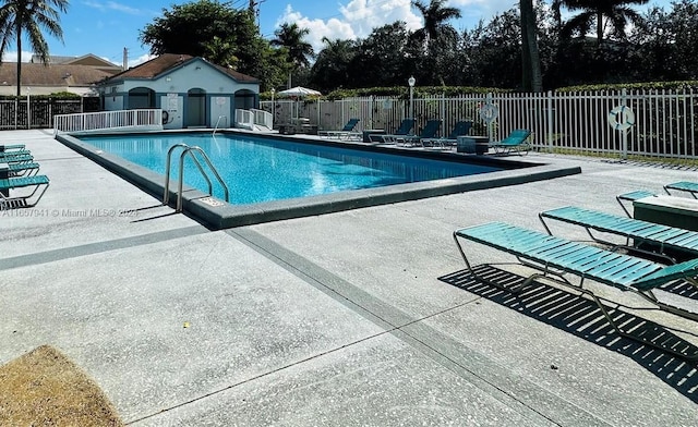 view of swimming pool featuring a patio area