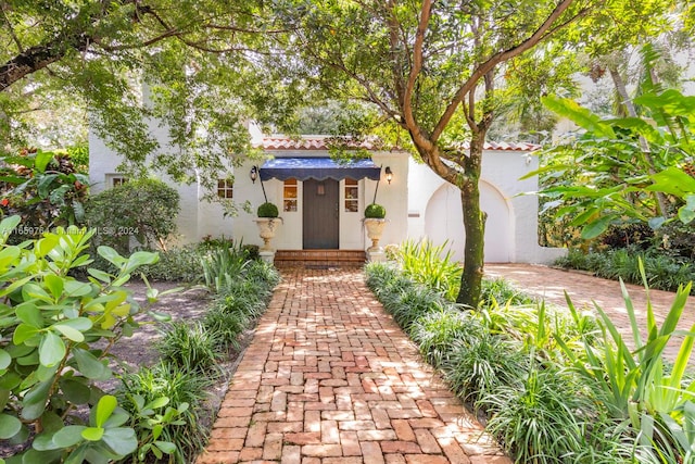 doorway to property featuring a garage