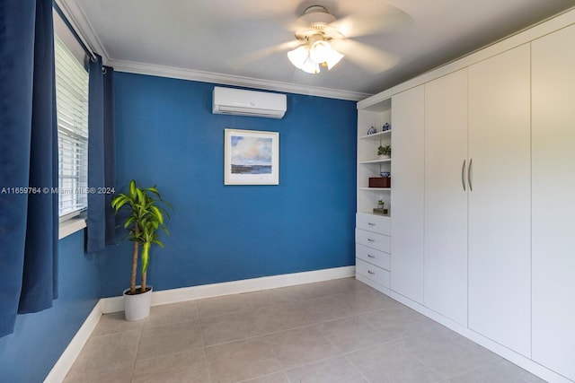 spare room featuring ceiling fan, ornamental molding, an AC wall unit, and light tile patterned flooring