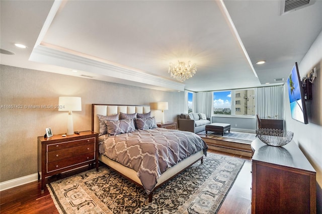 bedroom featuring dark wood-type flooring and a chandelier