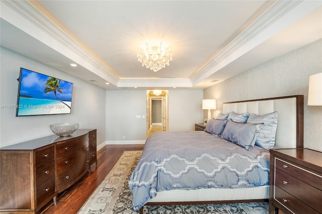 bedroom featuring a tray ceiling, ornamental molding, and dark hardwood / wood-style flooring