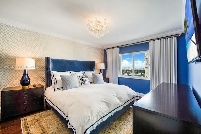 bedroom with hardwood / wood-style flooring, a notable chandelier, and ornamental molding