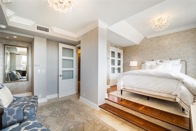 bedroom with crown molding and an inviting chandelier