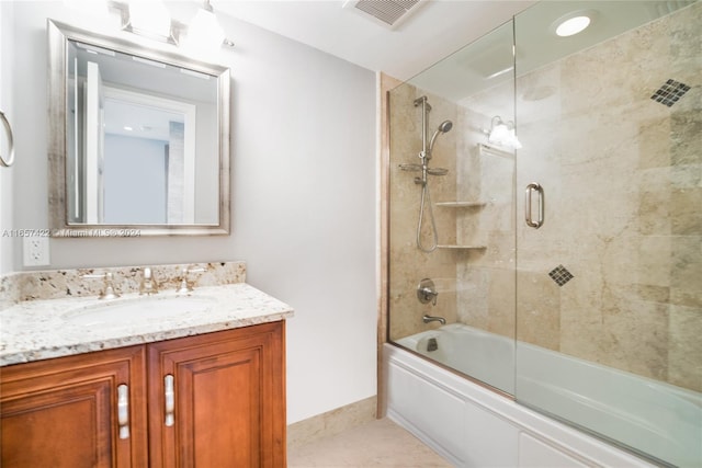 bathroom with shower / bath combination with glass door, vanity, and tile patterned floors