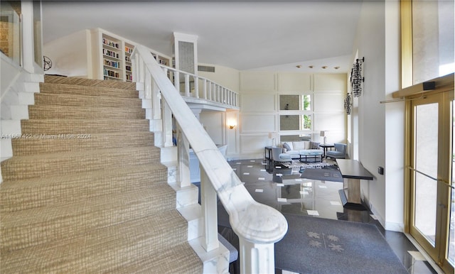 stairs with tile patterned flooring and plenty of natural light