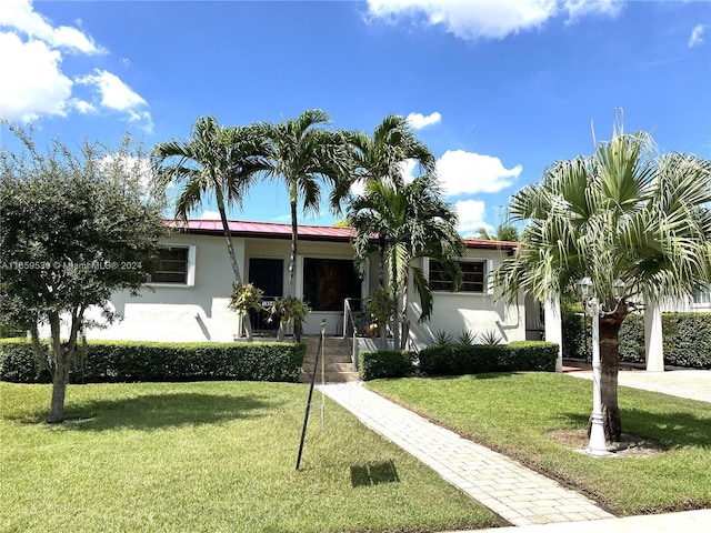 view of front of house with a porch and a front lawn