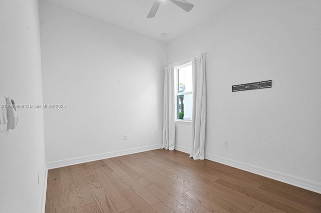 unfurnished room with hardwood / wood-style floors and ceiling fan