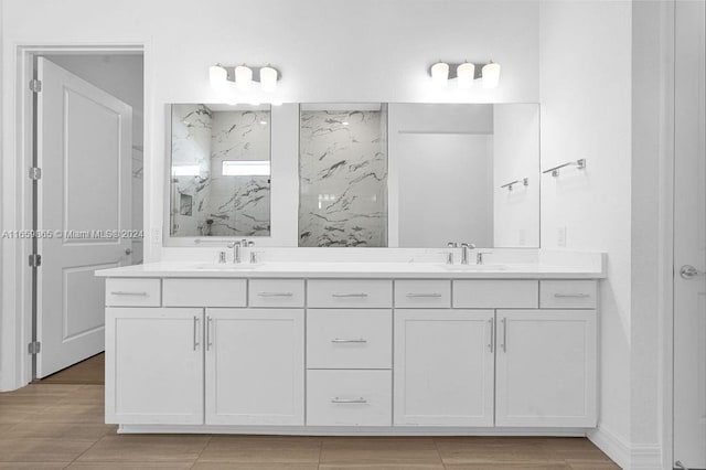 bathroom with vanity and walk in shower