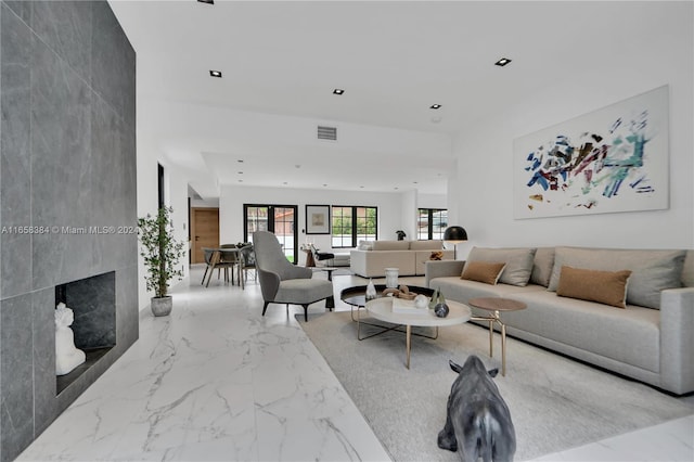 living room featuring a premium fireplace