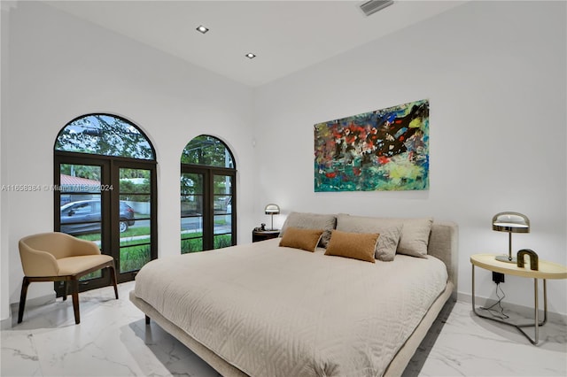 bedroom with a high ceiling