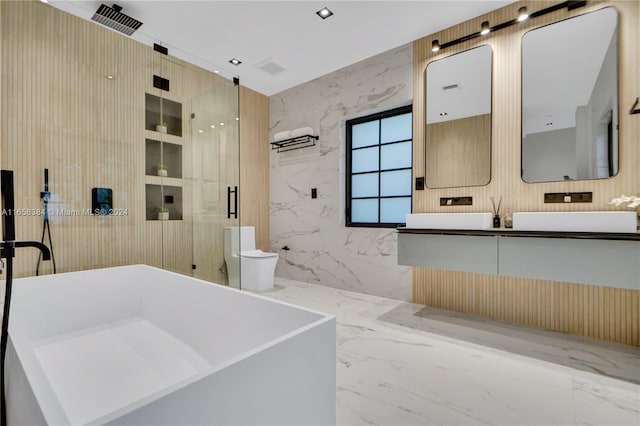 bathroom with vanity, a shower with shower door, and toilet