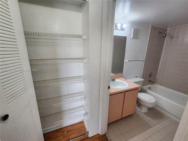 8240 SW 210th St Unit 302, Cutler Bay, FL 33189 - bathroom with vanity, shower / washtub combination, toilet, and tile patterned flooring