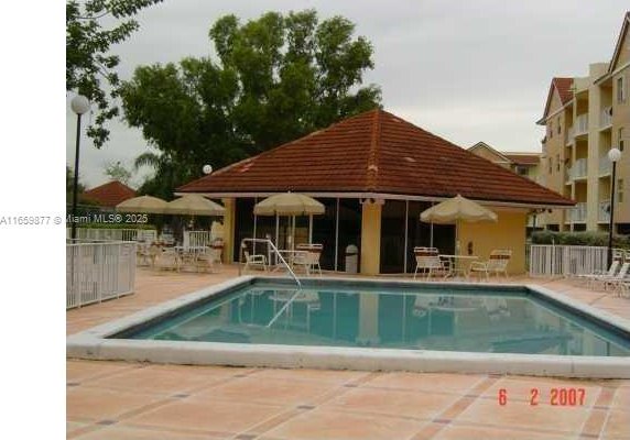 8240 SW 210th St Unit 302, Cutler Bay, FL 33189 - community pool with a patio
