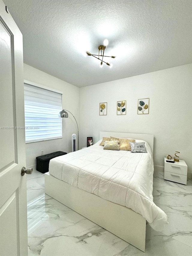 bedroom with a textured ceiling