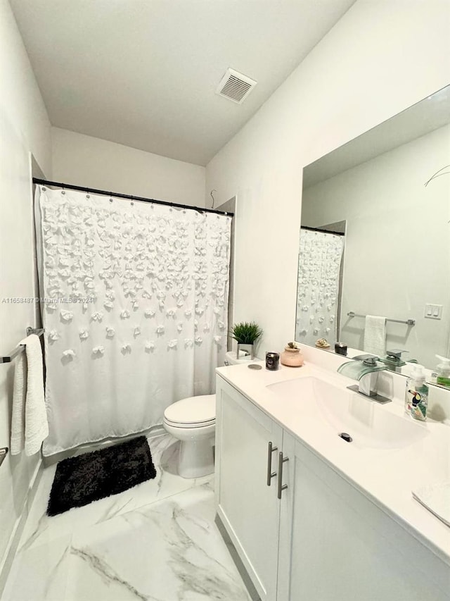 bathroom featuring vanity, toilet, and a shower with curtain