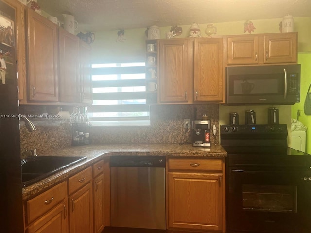 kitchen with black appliances and sink