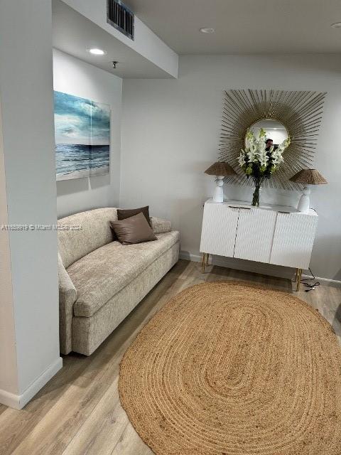 living area featuring hardwood / wood-style floors