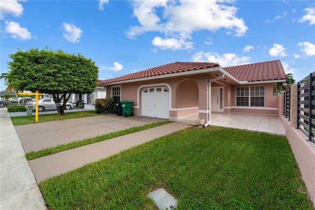 view of front of property with a garage and a front yard