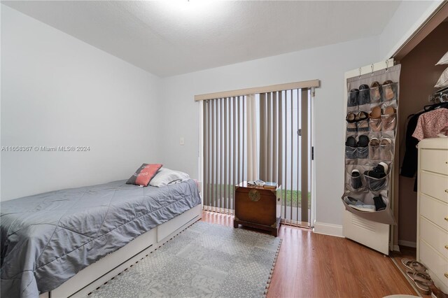 bedroom featuring wood-type flooring