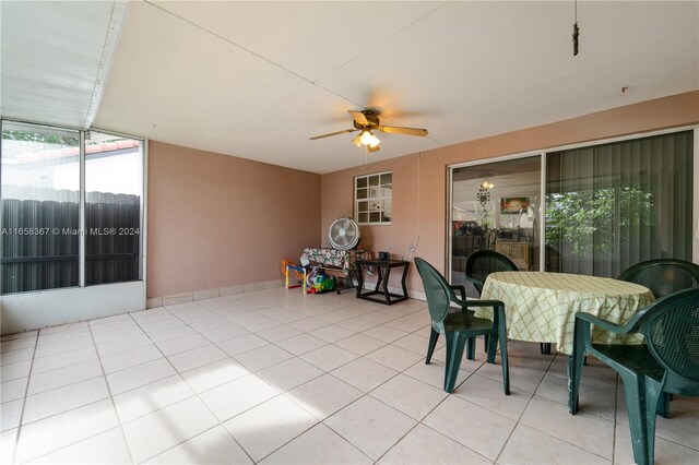 interior space with ceiling fan and light tile patterned floors