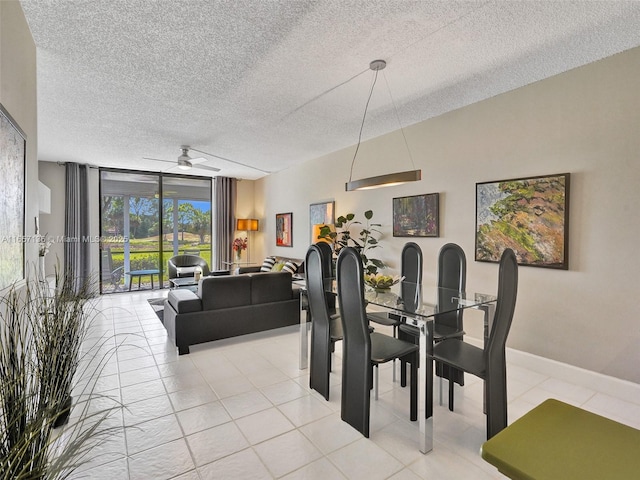 dining area featuring ceiling fan, light tile patterned floors, floor to ceiling windows, and a textured ceiling