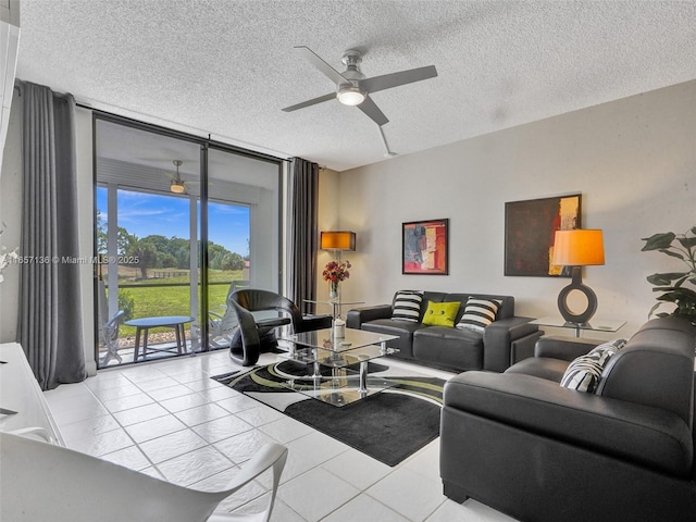 living room with floor to ceiling windows, a textured ceiling, ceiling fan, and light tile patterned flooring