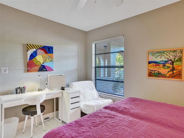 tiled bedroom featuring ceiling fan