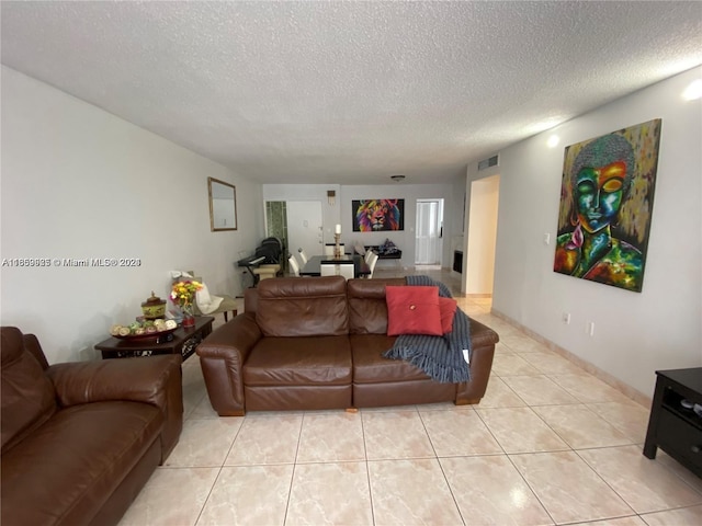 tiled living room with a textured ceiling