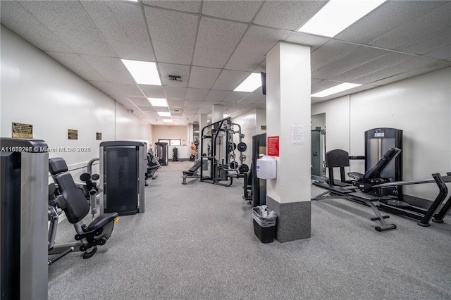 exercise room featuring a drop ceiling