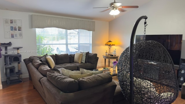 living room featuring lofted ceiling, hardwood / wood-style floors, and ceiling fan