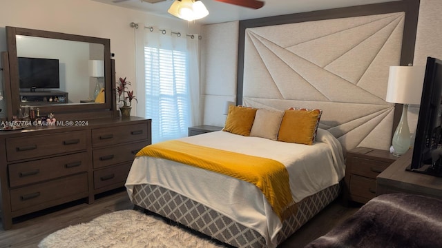 bedroom featuring ceiling fan and dark hardwood / wood-style floors