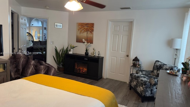 bedroom featuring dark hardwood / wood-style flooring and ceiling fan