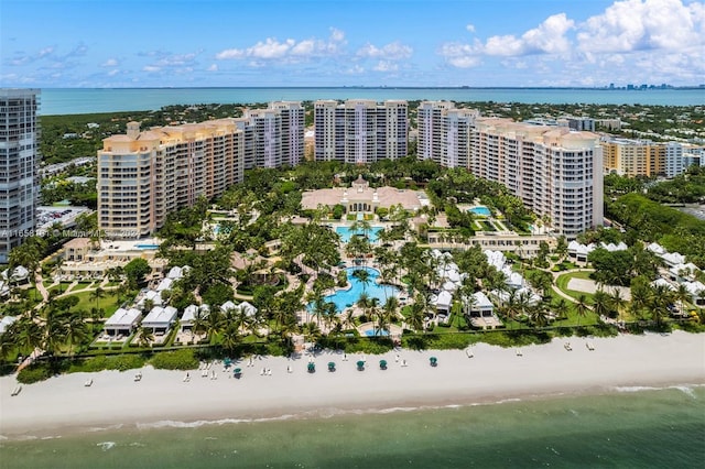 aerial view with a water view and a view of the beach