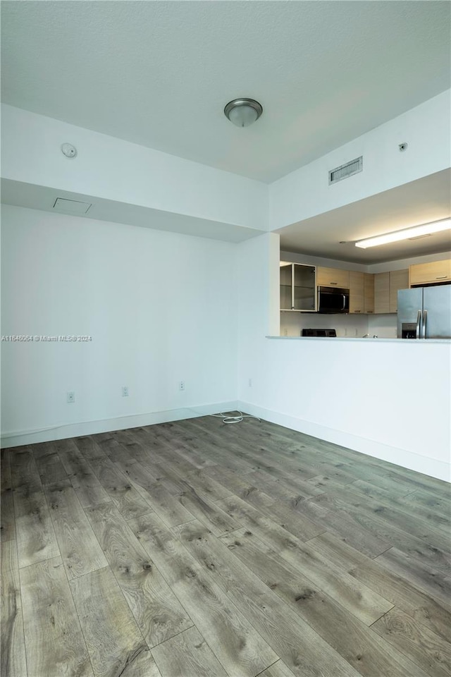 unfurnished living room with light hardwood / wood-style floors