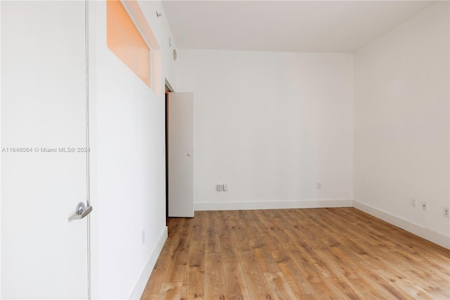 empty room with light hardwood / wood-style floors