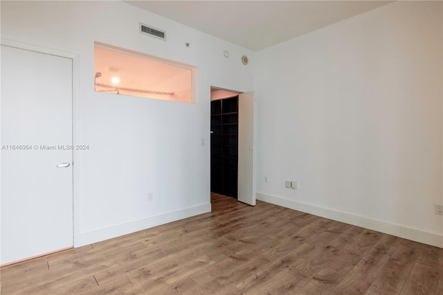 unfurnished room with light hardwood / wood-style floors