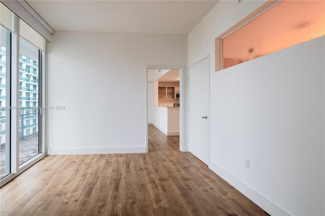 spare room with light hardwood / wood-style floors