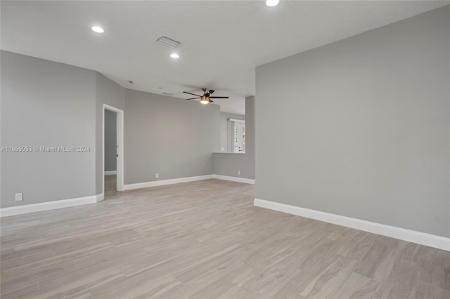 unfurnished room with ceiling fan and light hardwood / wood-style floors