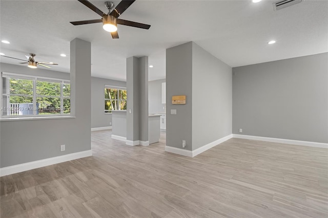 interior space featuring ceiling fan and light hardwood / wood-style flooring