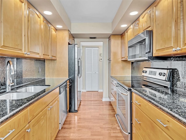 900 Saint Charles Pl Unit 718, Pembroke Pines, FL 33026 - kitchen with stainless steel appliances, recessed lighting, light wood-type flooring, dark stone countertops, and decorative backsplash
