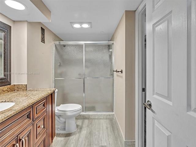 900 Saint Charles Pl Unit 718, Pembroke Pines, FL 33026 - full bathroom featuring vanity, wood finished floors, and a stall shower