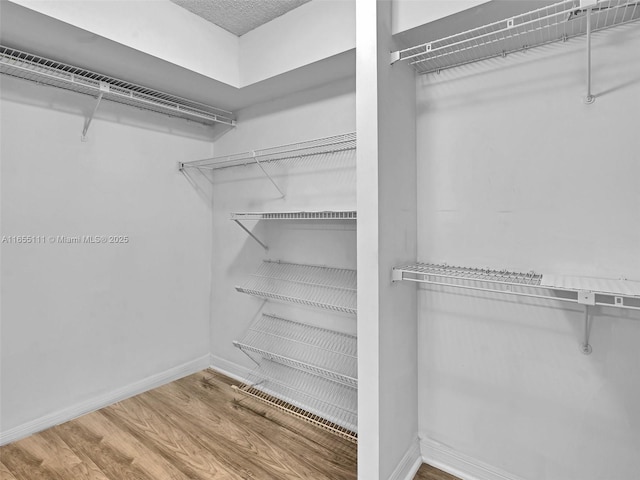 900 Saint Charles Pl Unit 718, Pembroke Pines, FL 33026 - spacious closet featuring wood finished floors