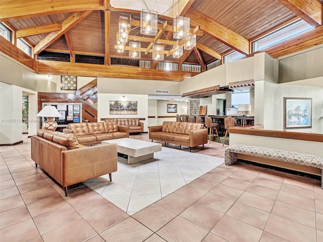 900 Saint Charles Pl Unit 718, Pembroke Pines, FL 33026 - living room with high vaulted ceiling, a wood ceiling with exposed beams, light tile patterned floors, and a chandelier
