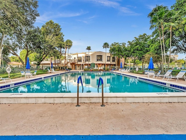 900 Saint Charles Pl Unit 718, Pembroke Pines, FL 33026 - community pool featuring a patio area