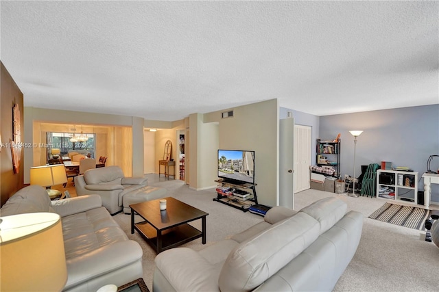 carpeted living room featuring a textured ceiling