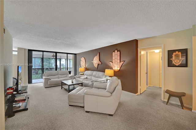 carpeted living room featuring a textured ceiling