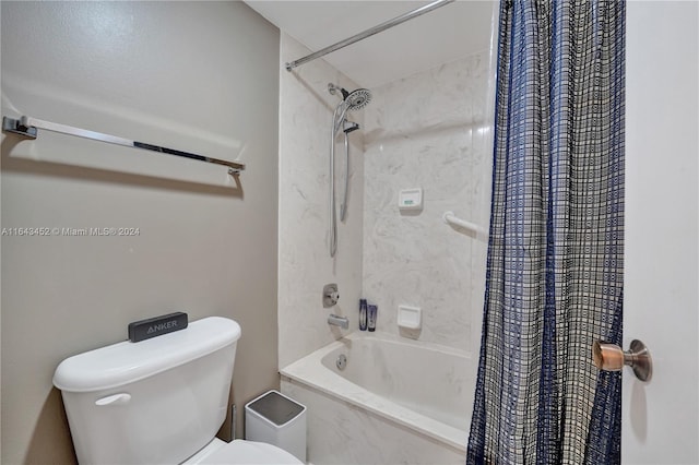 bathroom featuring toilet and shower / tub combo